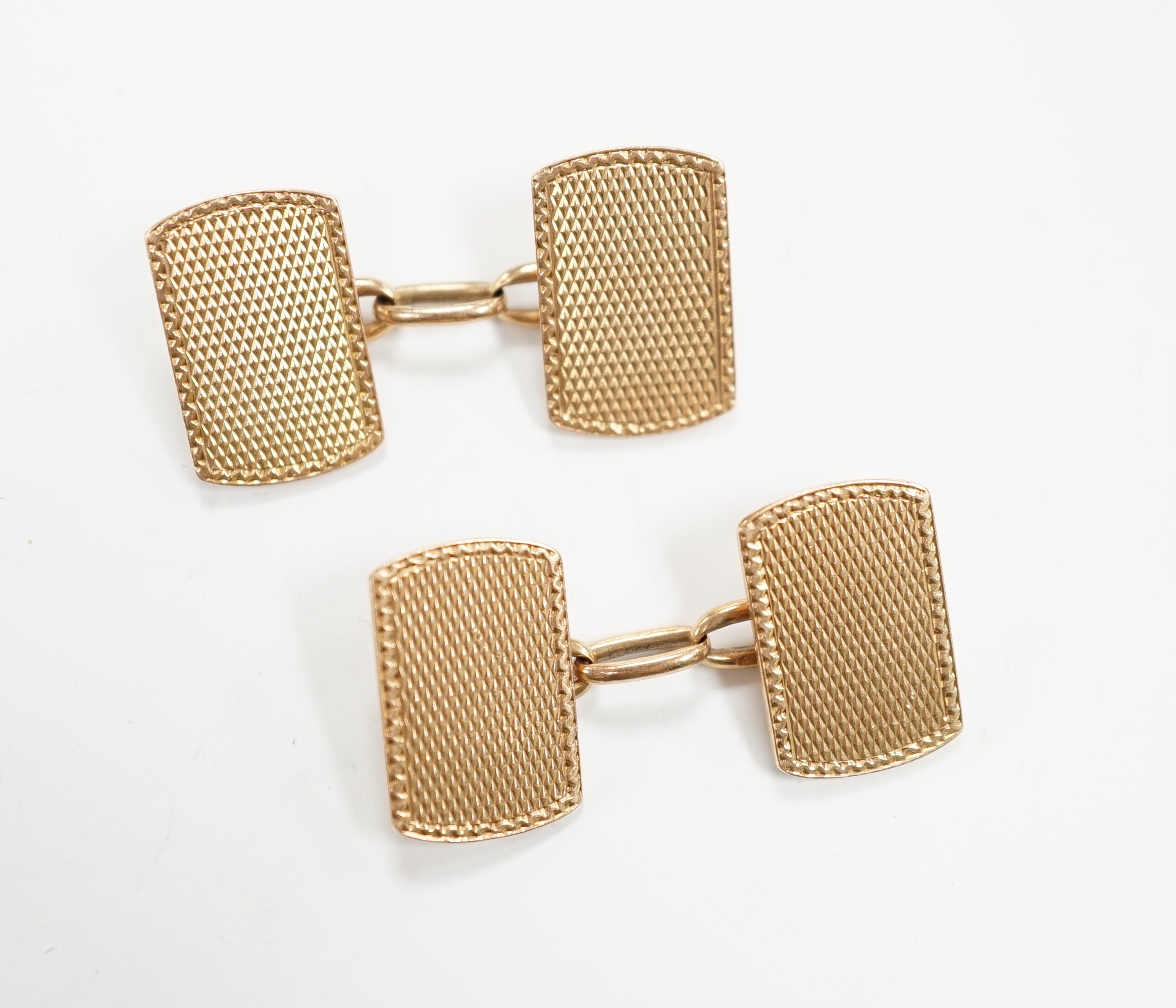 A pair of 1930's engine turned 9ct gold rounded rectangular cufflinks, 16mm, 8.8 grams.